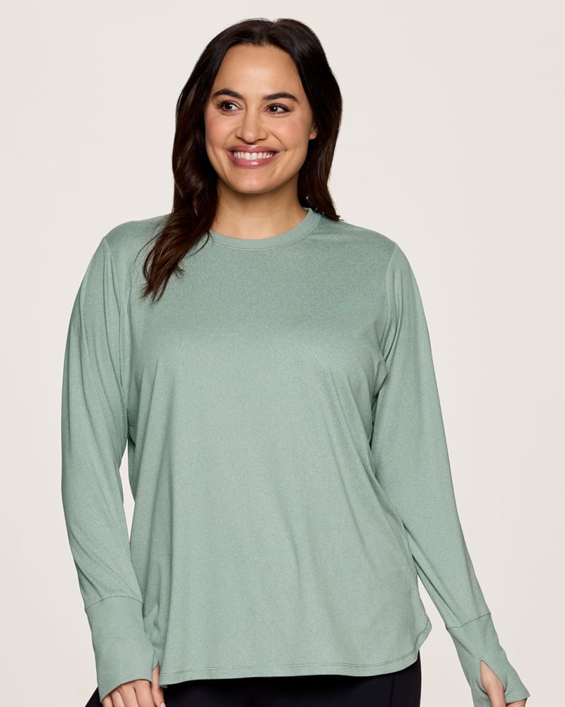 Front of a model wearing a size 1X Plus Studio Super Soft Tunic Tee in Sea Glass by RBX Active. | dia_product_style_image_id:341668